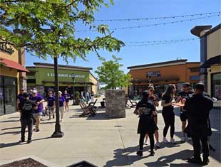 people walking around the The Outlets of Des Moines