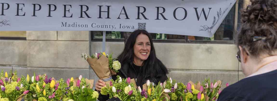 woman smiling with flowers