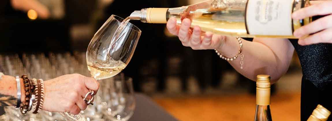 woman pouring wine