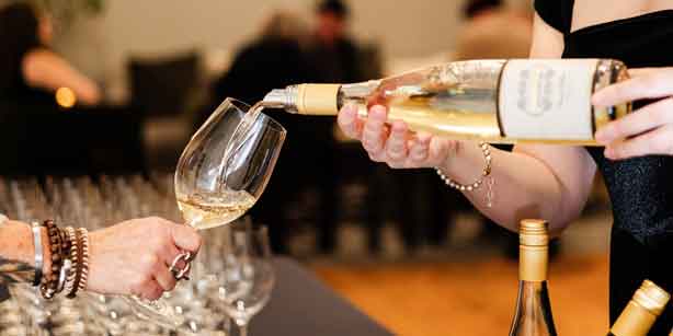 woman pouring wine