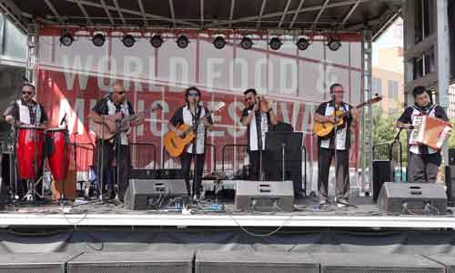 musicians play on stage at Music in the Junction