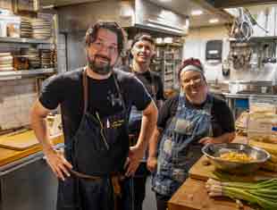Cheff Tripp and crew in the kitchen