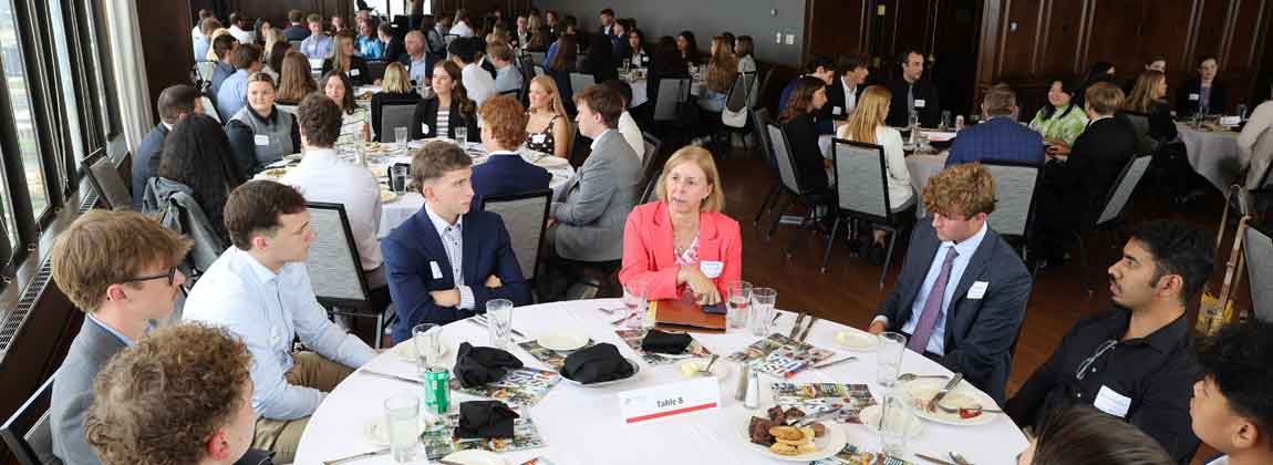 interns at tables during DSM Intern Connection event