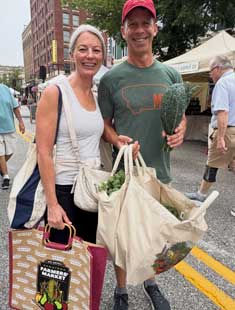 two people with shopping bags