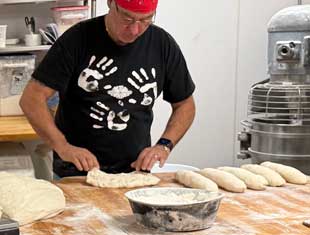 George Formaro rolling bread
