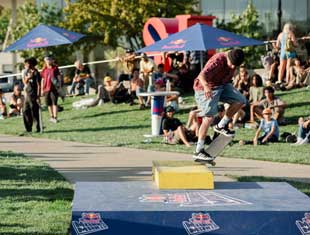 person skateboarding as people watch