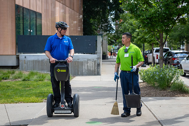 Two ambassadors talking as they go down the street