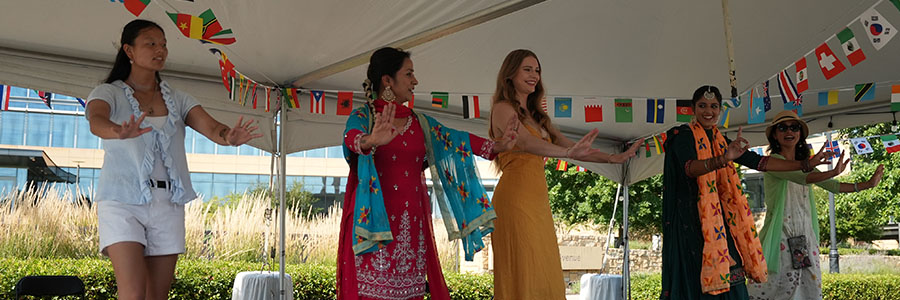 Cultural Stage Five women dancing on stage